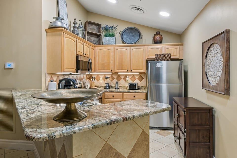 Your fully equipped kitchen invites culinary adventures with granite counters, stainless appliances, and charming southwestern touches throughout.