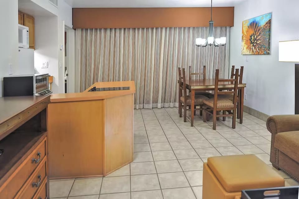 Gather for easy meals at the dining table under warm light