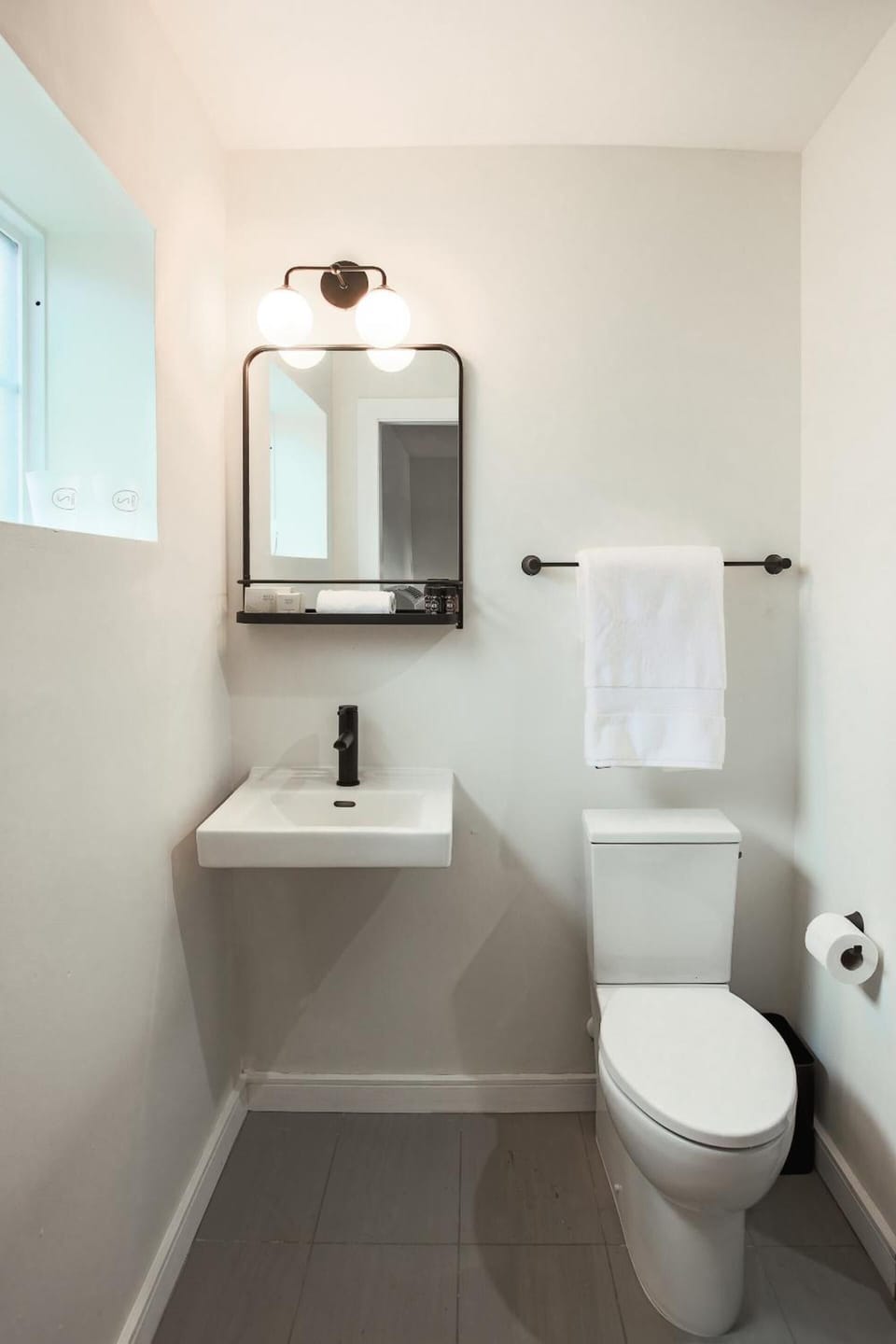 Freshen up in a bright, modern bath with fluffy towels