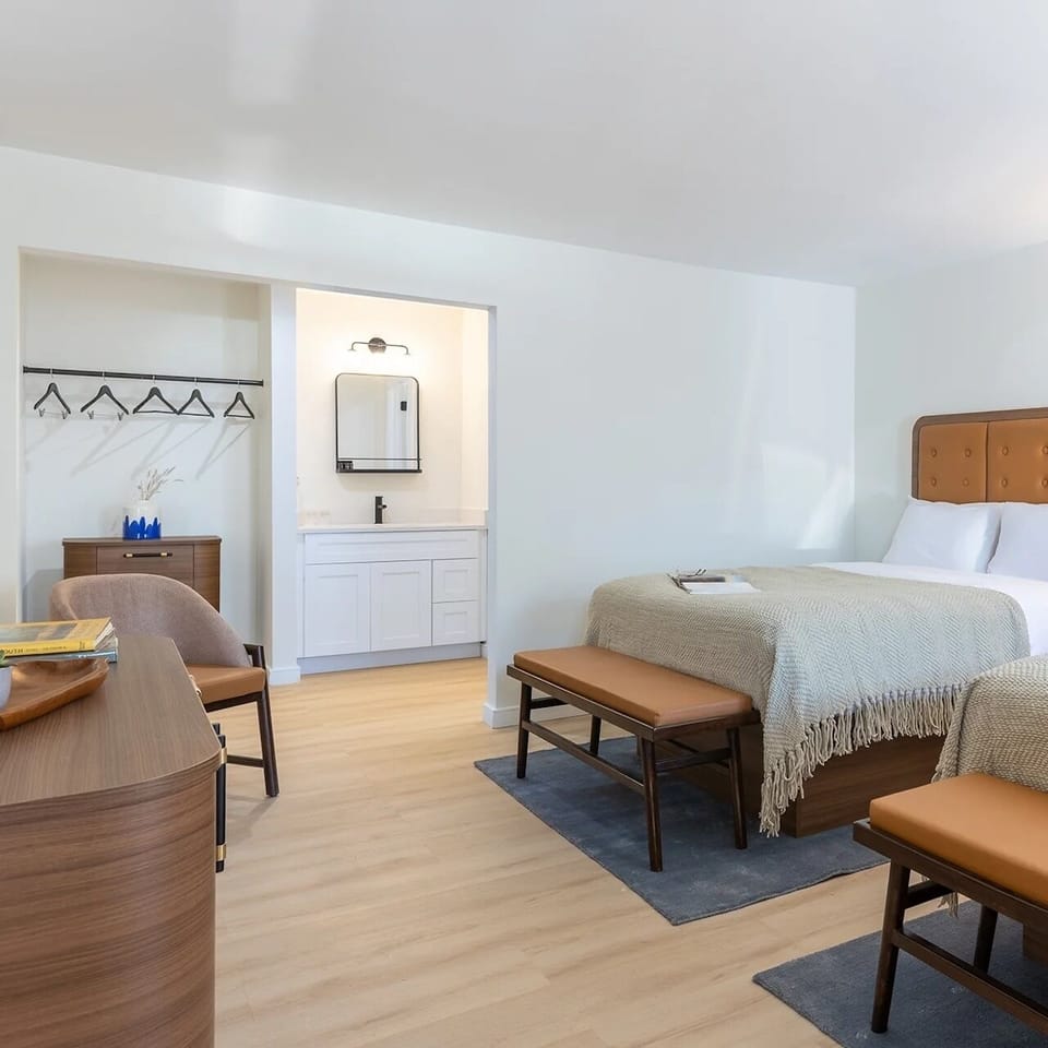 Spread out comfortably with open storage and a handy vanity nook.