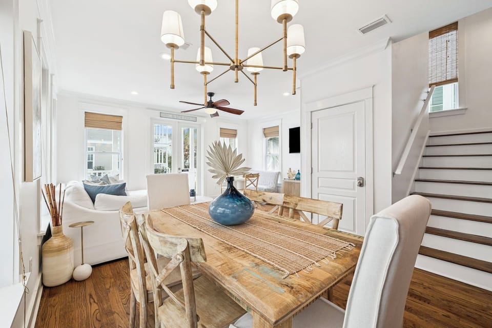 Gather around your elegant dining table where coastal-inspired décor meets warm wood tones, creating the perfect spot for memorable meals together.