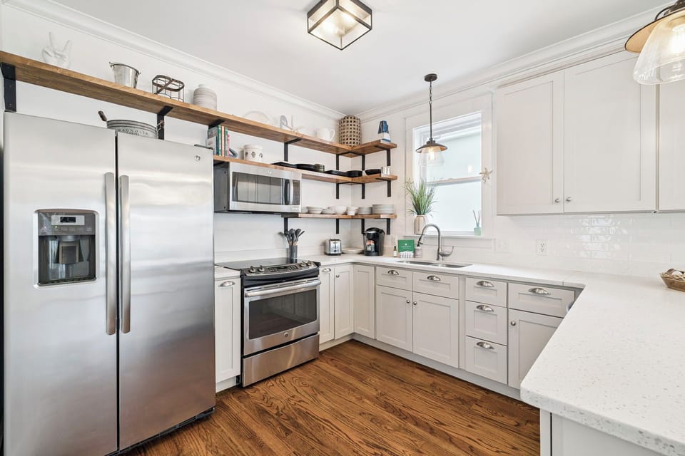 Your fully equipped kitchen features modern appliances and ample counter space for preparing memorable meals during your stay.