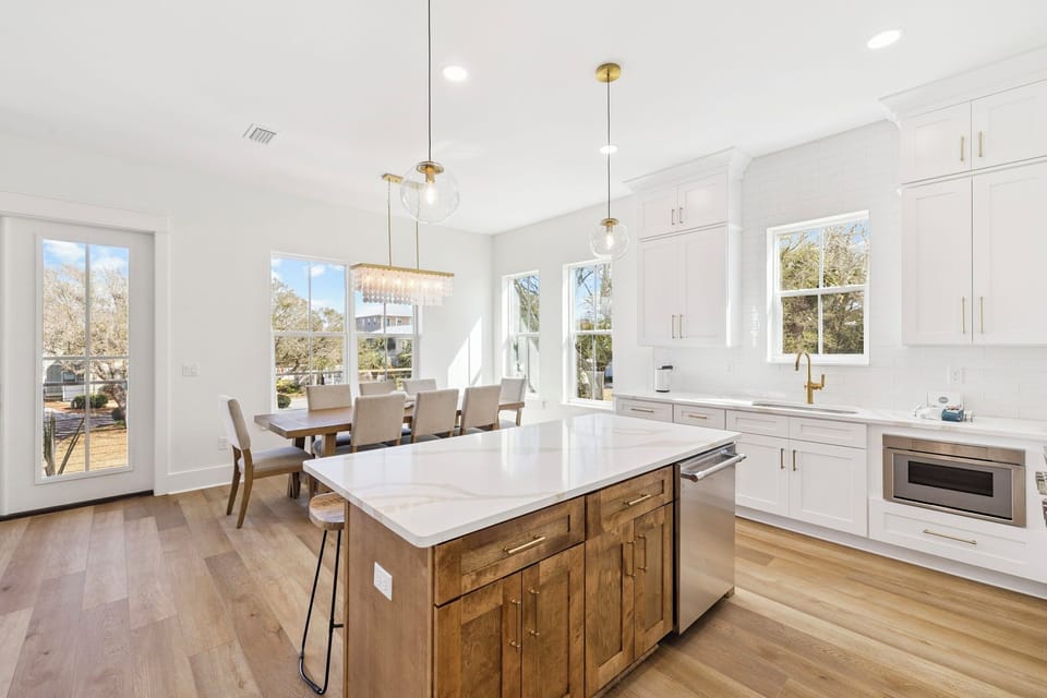Your open-concept kitchen and dining space features gleaming countertops, modern appliances, and elegant lighting for memorable meal prep and gathering moments.
