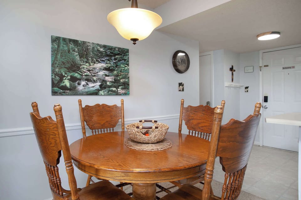 Gather for meals together at the dining table, offering seating for 4
