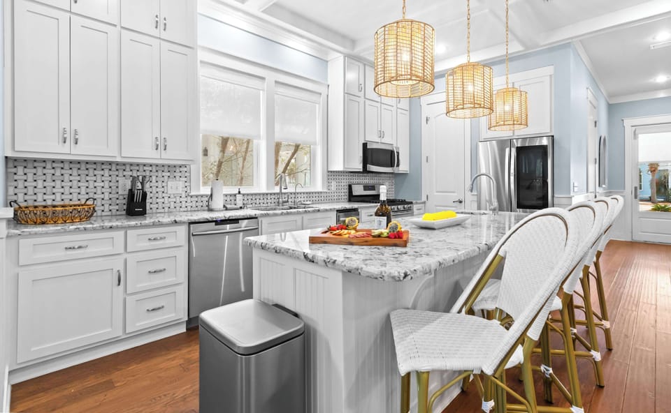 Kitchen: Drip coffee maker, Keurig, food processor, blender, toaster oven, cooking utensils, tableware
