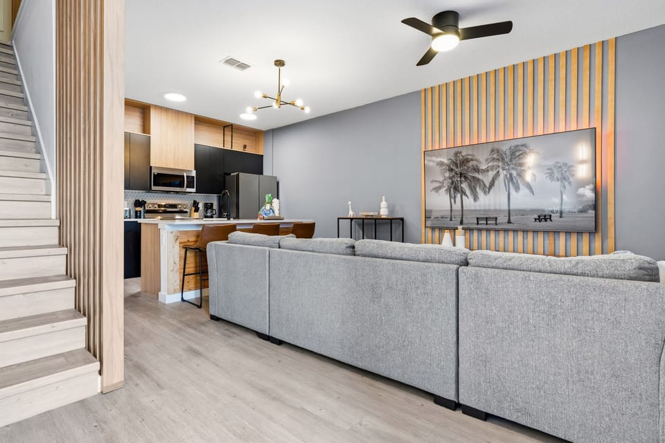 Spacious living area with modern décor and open kitchen layout
