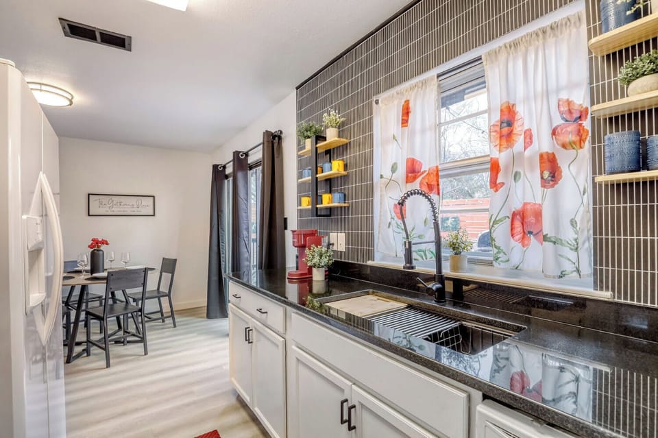 Bright, functional kitchen with ample counter space, natural light, and everything you need for cooking or longer stays