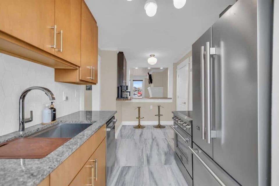 Kitchen with bar area for four. 