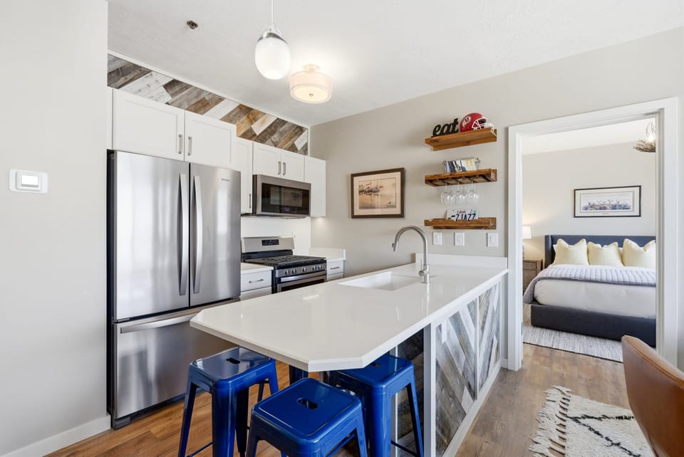 well-appointed dining area and kitchen with view of master bedroom
