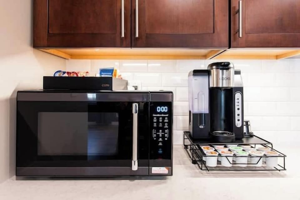Bright and functional kitchen featuring sleek countertops and ample cooking space.