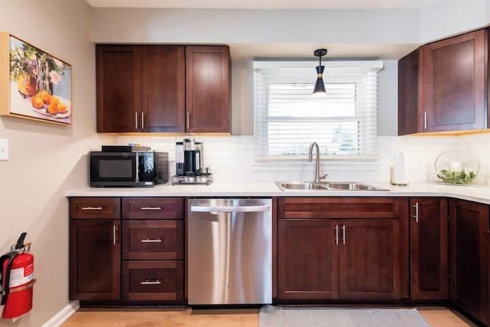Bright and functional kitchen featuring sleek countertops and ample cooking space.