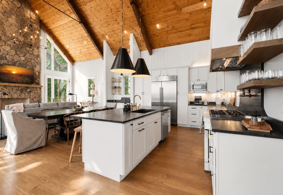 Sleek surfaces, curated finishes, and a layout made for gathering. This modern cabin kitchen invites connection while maintaining an effortlessly luxe aesthetic.