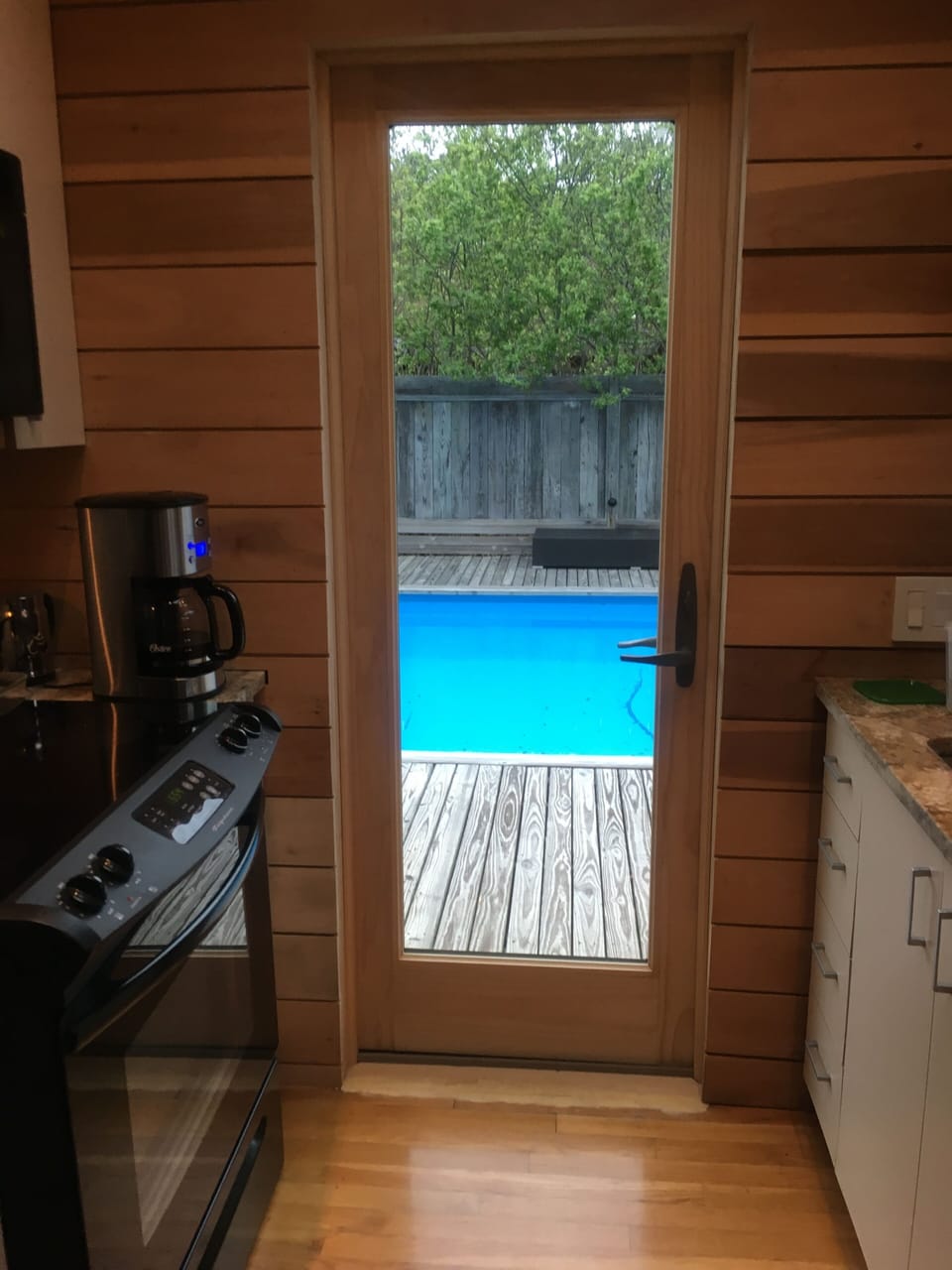 Kitchen door access to the pool deck.