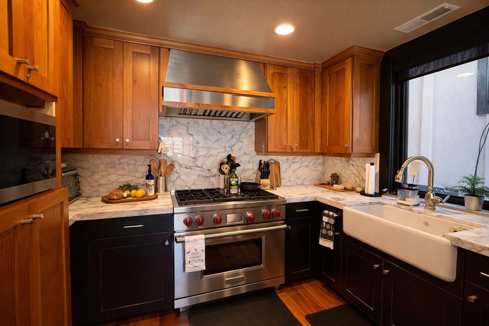 Cook and gather in a beautifully designed kitchen featuring premium appliances, stone countertops, and everything you need for meals at home.