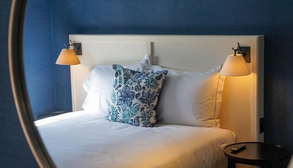Snuggle into fresh linens with cozy, boutique-style ambiance.