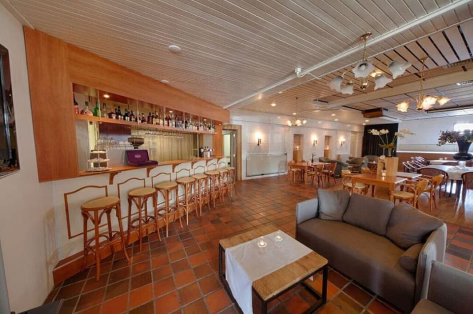 Relax on comfortable sofas after drinks at the classic bar.