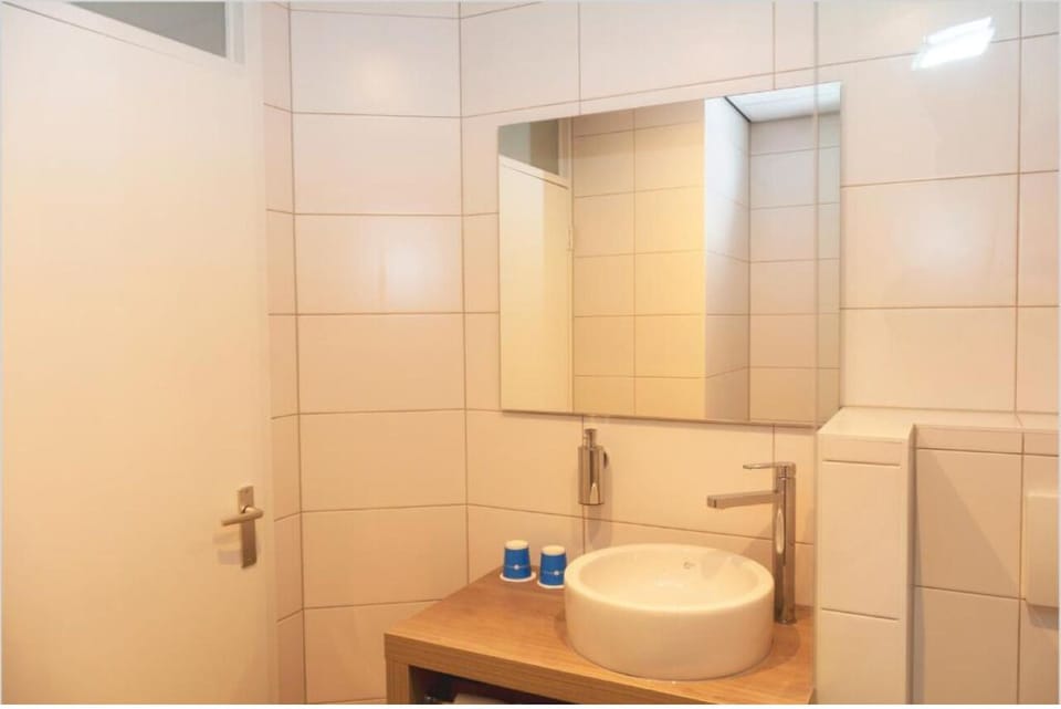 Refresh in a bright, spotless bathroom with modern vanity.