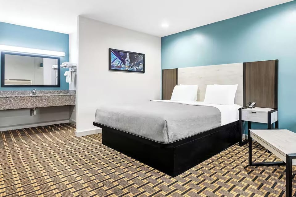 Freshen up easily with an in-room vanity steps from bed.