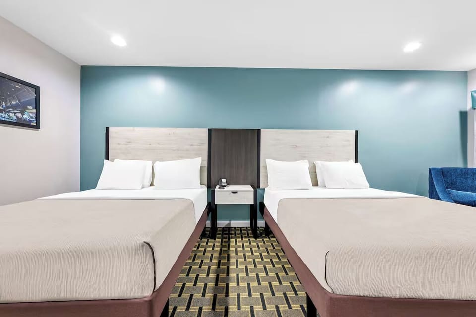 Settle into crisp linens and enjoy a spacious double-bed room.