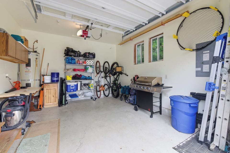 Spacious garage with organized storage, bike racks, BBQ grill, and ample room for your gear and outdoor adventures.