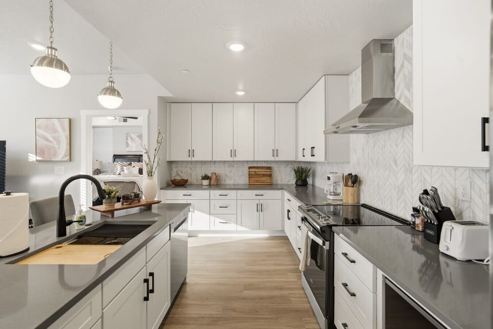 Modern kitchen with island, lighting, and clean finishes