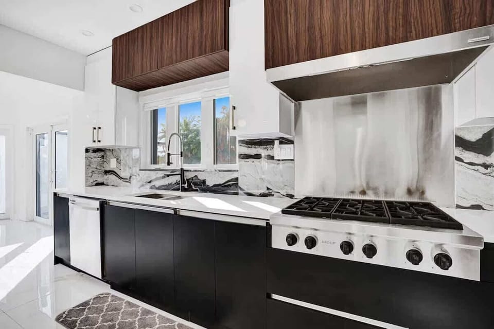 Gourmet kitchen details featuring a high-end gas stove and custom cabinetry.