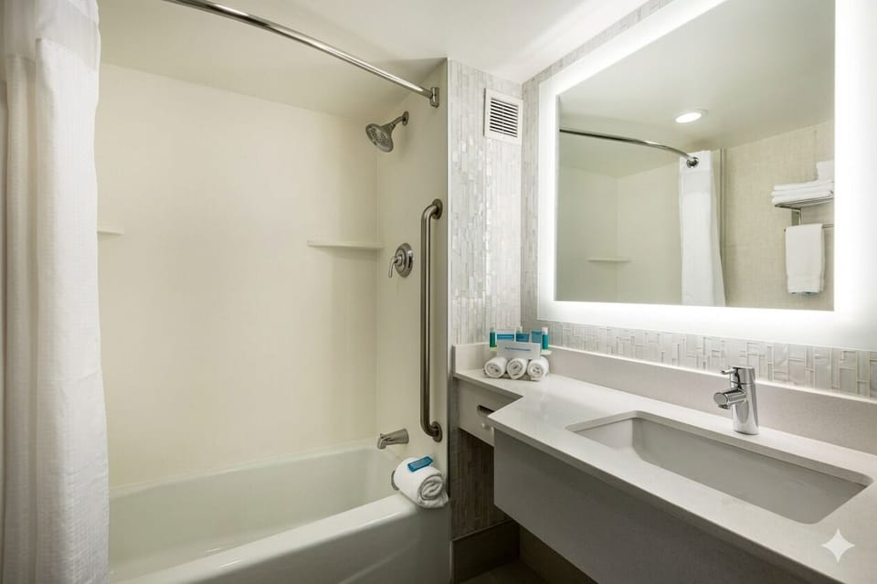 Refresh under a hot shower with a spa-bright vanity.