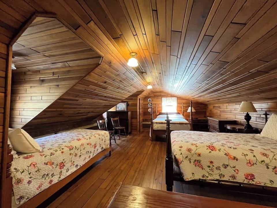 Upstairs features floor-to-ceiling hardwood, 3 beds, and a full bathroom.