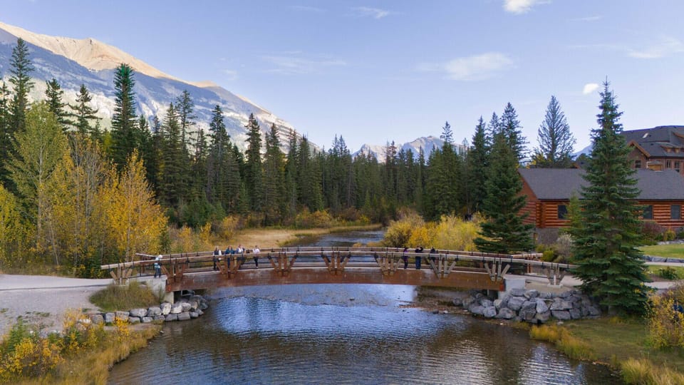 Scenic pedestrian bridge over the river—perfect for a morning stroll.