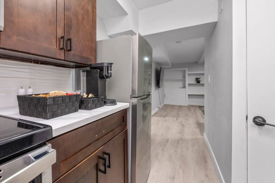 Fully equipped kitchen with coffee station and essential appliances for daily use.