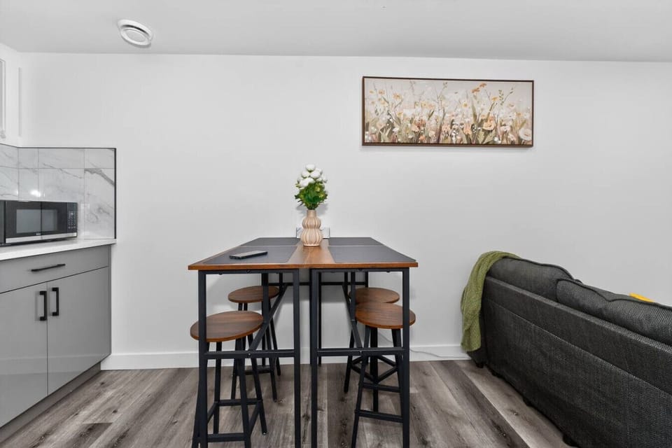 Dining area with seating and open living space