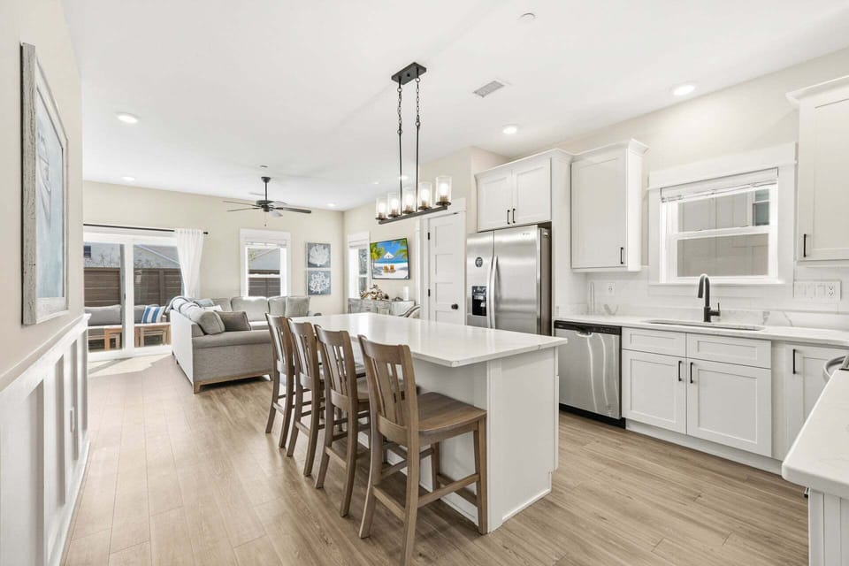 Kitchen: Modern appliances, sleek finishes, and a breakfast bar for easy meal prep and casual dining.