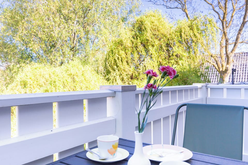 Terrace with Table and Flowers