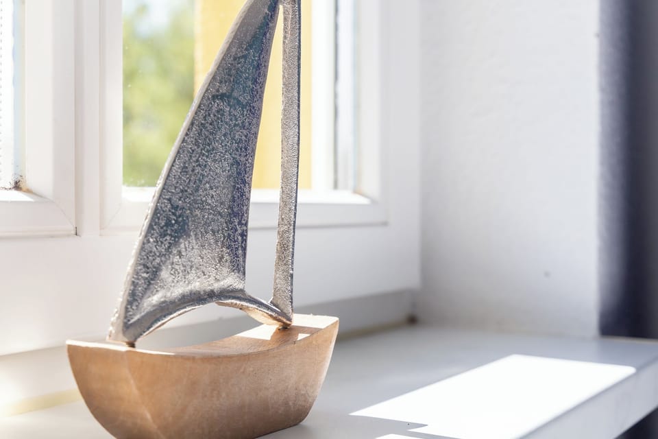 Decorative Sailboat Sculpture on Windowsill