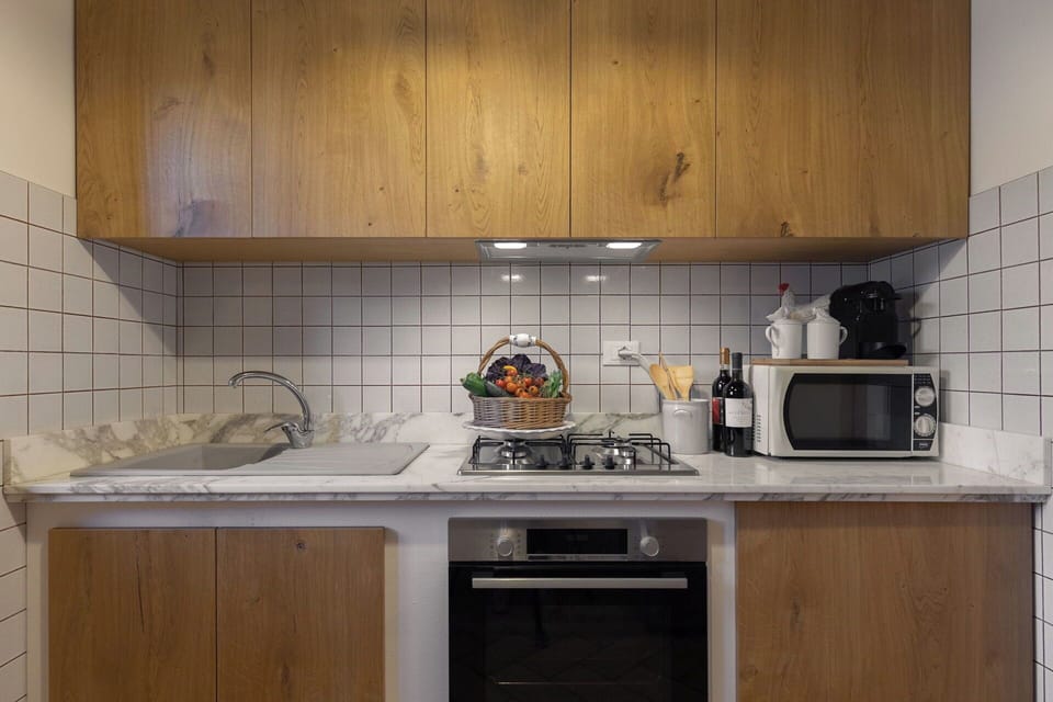 Kitchen Appliance, Kitchen, Countertop, Major Appliance, Cabinetry, Interior Design, Home Appliance, Wood, Kitchen Stove, Stove