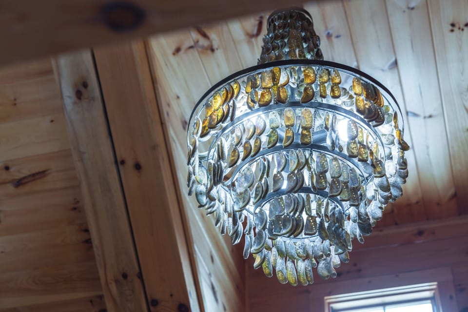 A unique light fixture adds a soft glow to the vaulted wood ceilings.