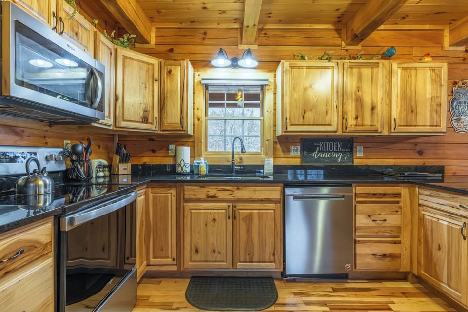 Modern appliances and ample counter space provide everything needed for preparing meals at home.