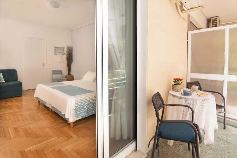 Private upstairs veranda with a seating area, perfect for enjoying the fresh air and relaxing views. Guests can enjoy breakfast outdoors or unwind with a drink while enjoying the peaceful surroundings