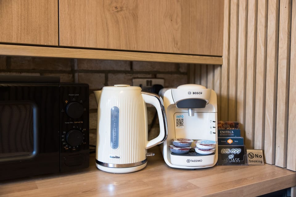 A microwave, kettle, and coffee machine are provided for your convenience.