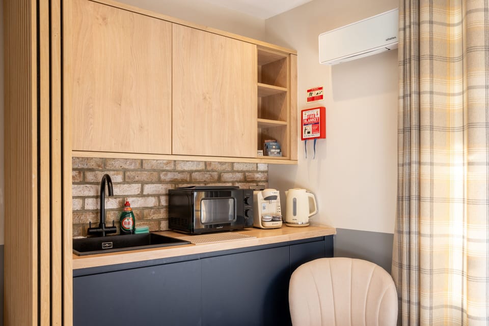 Kitchen space in studio for guest convenience