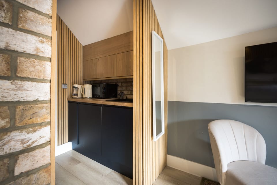 Stylish studio with lovely decor and a kitchen area for a comfortable stay.
