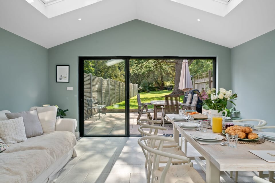 Open plan, kitchen, dining area and sofa onto long private garden with terrace