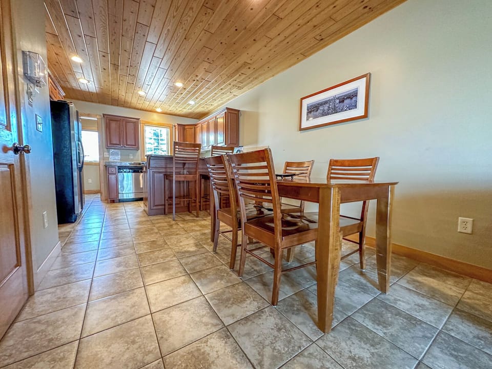 There is a dining area with seating for four.