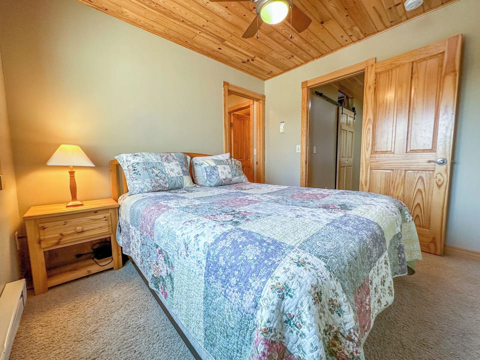 This bedroom also has an attached bathroom.