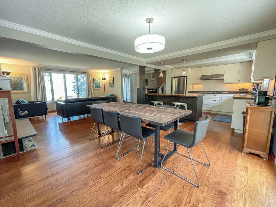 The dining room offers room for 8 to sit at the table with two additional seat at the kitchen counter