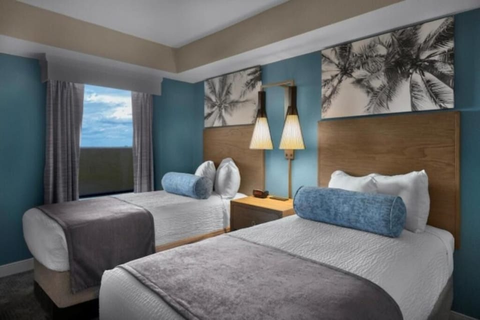 Drift off in two comfy beds after a beach day.