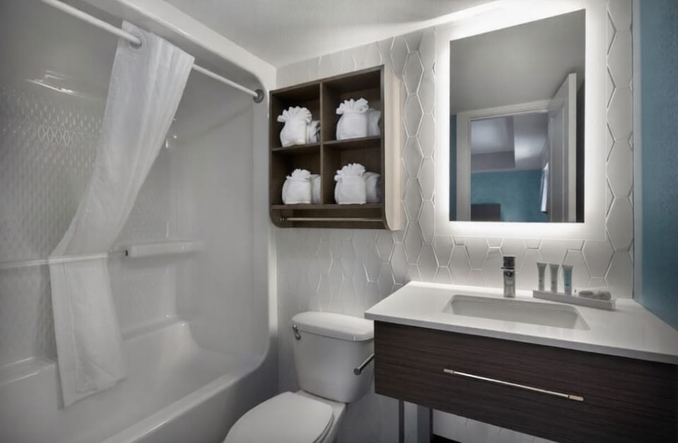 Pamper yourself with plush towels and a sleek vanity.