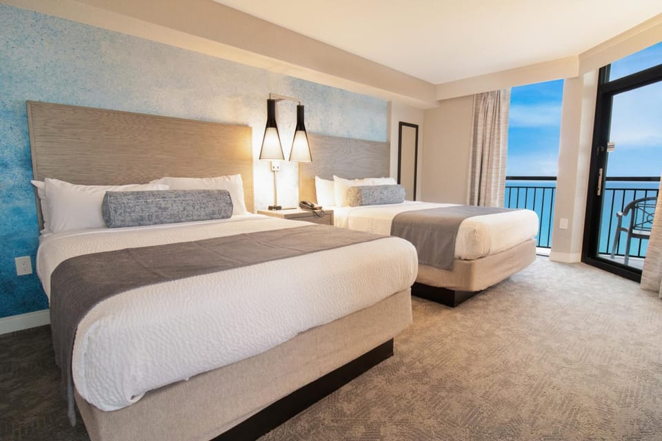 Wake up to sunrise light with beds facing the sea.