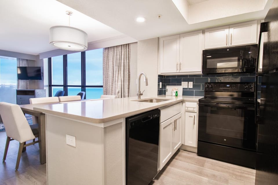 Cook seaside meals in a bright, fully equipped kitchen.
