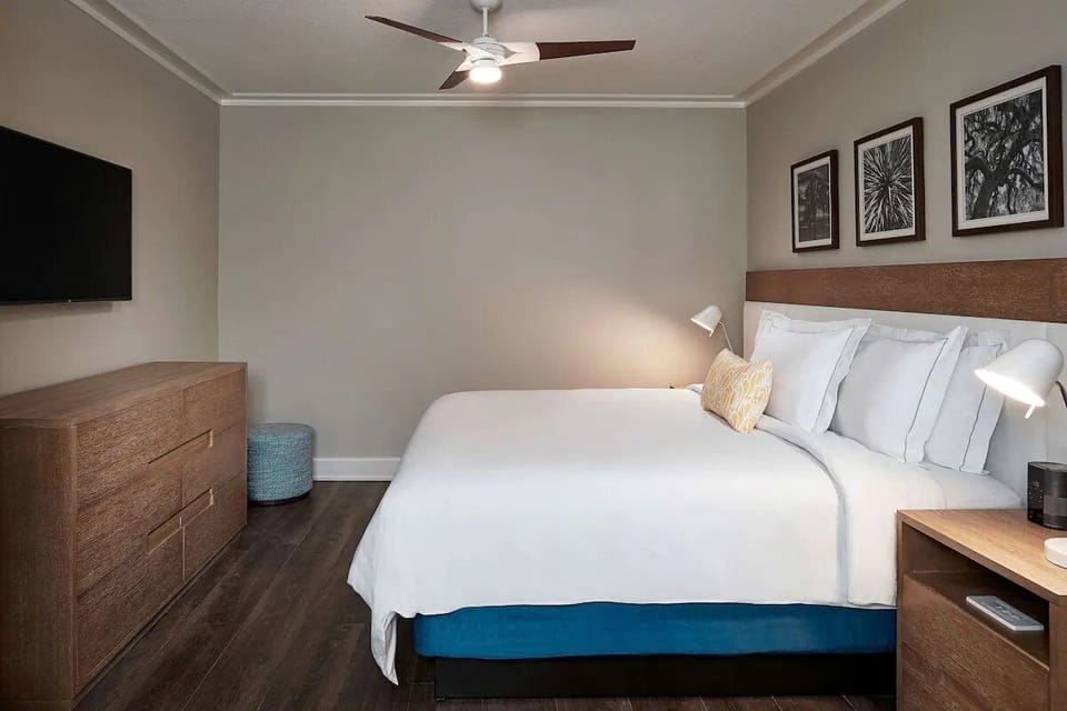 Relax in a serene bedroom designed for deep, easy sleep.